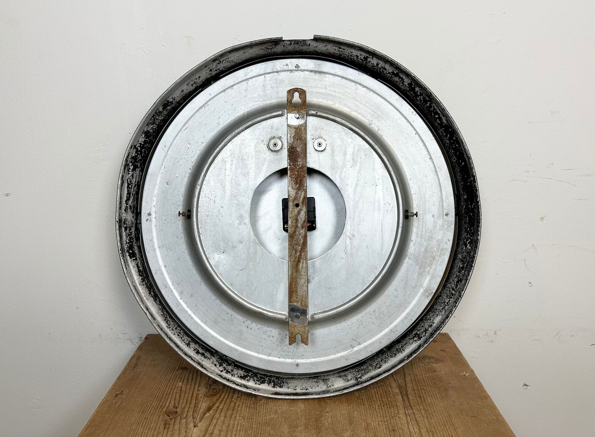 Black swiss industrial wall clock from inducta, 1960s