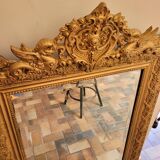 Old gilded mirror with pediment
