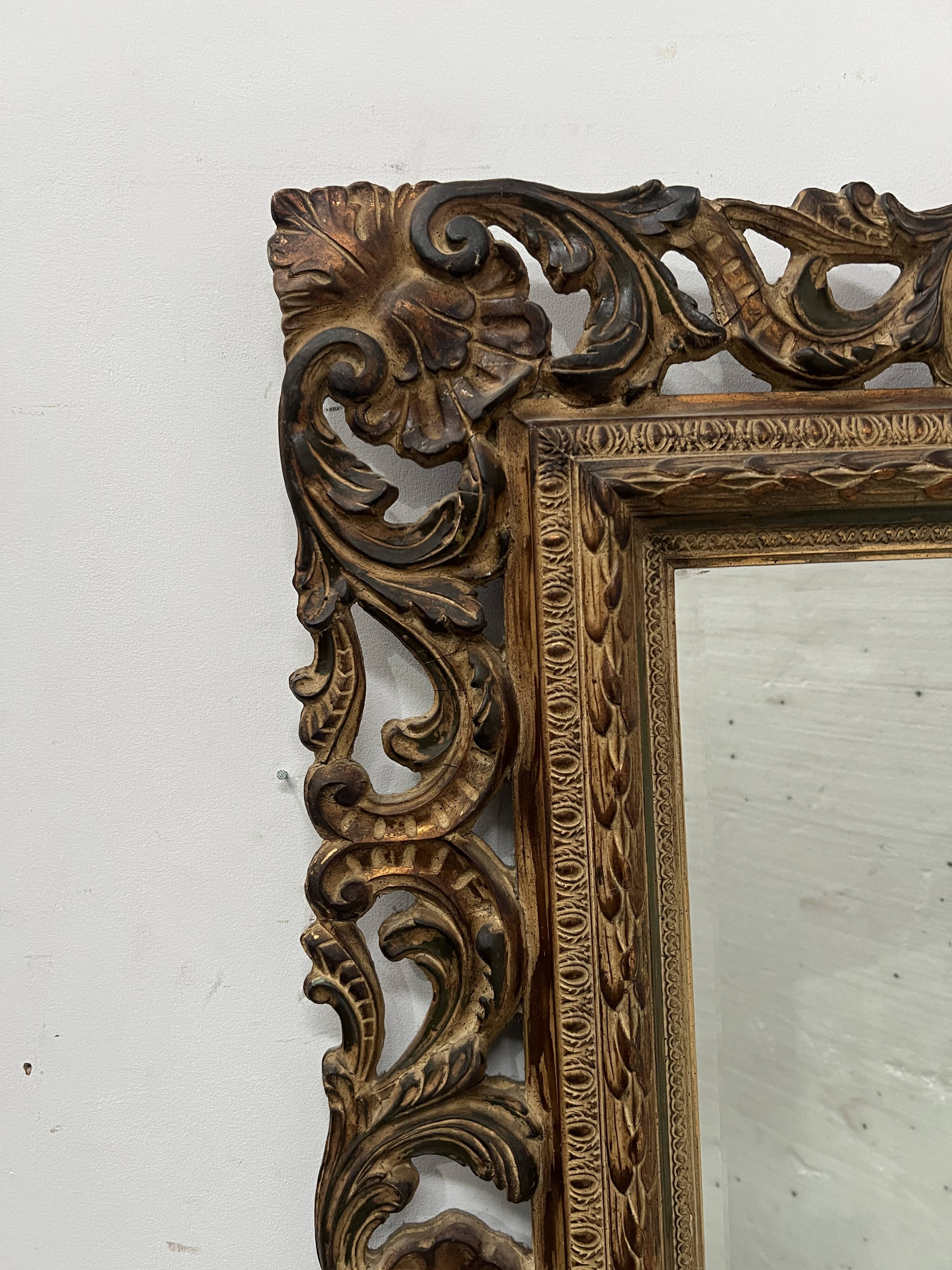Napoleon III style mirror in carved wood, 20th century.