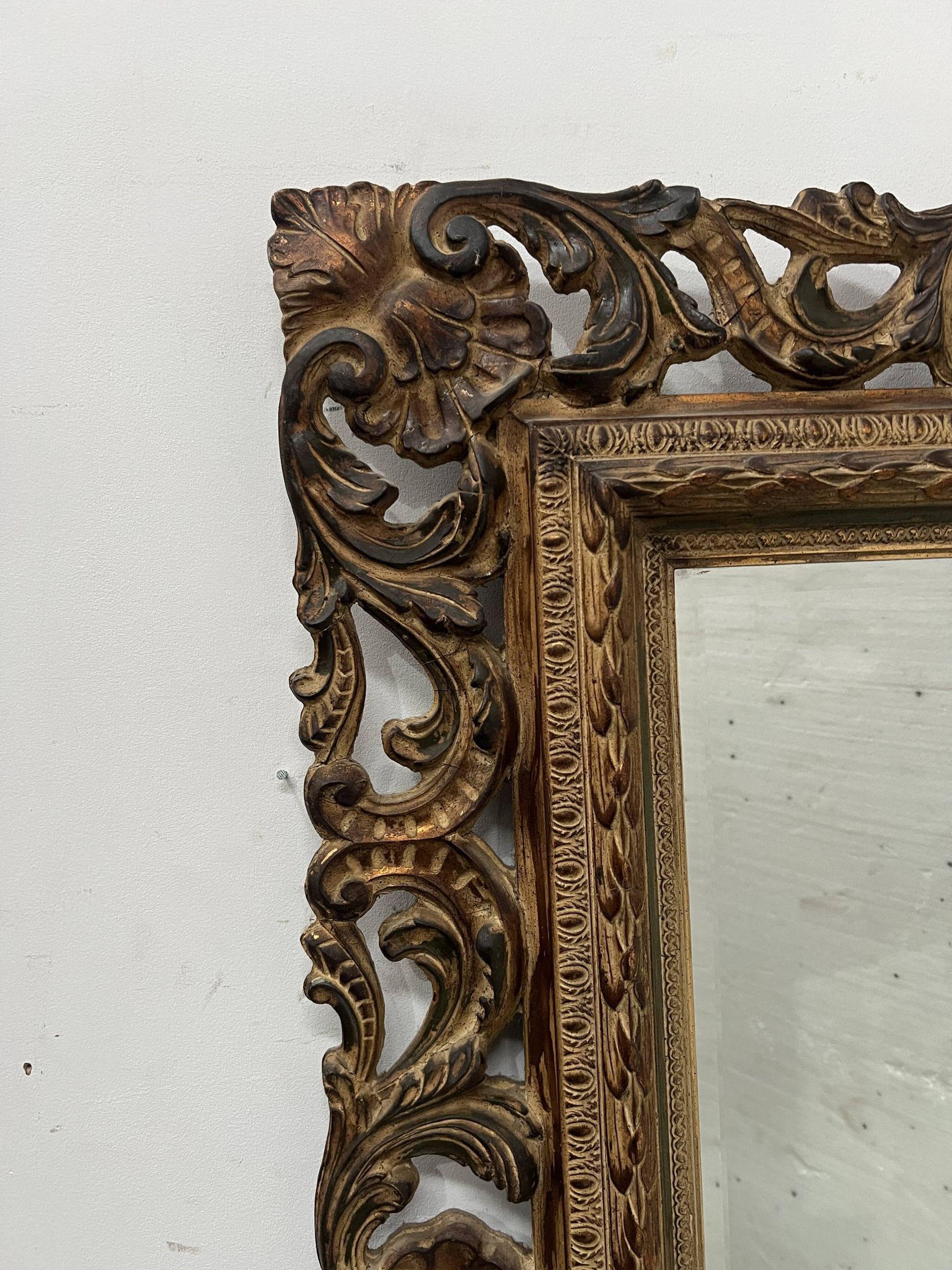 Napoleon III style mirror in carved wood, 20th century.