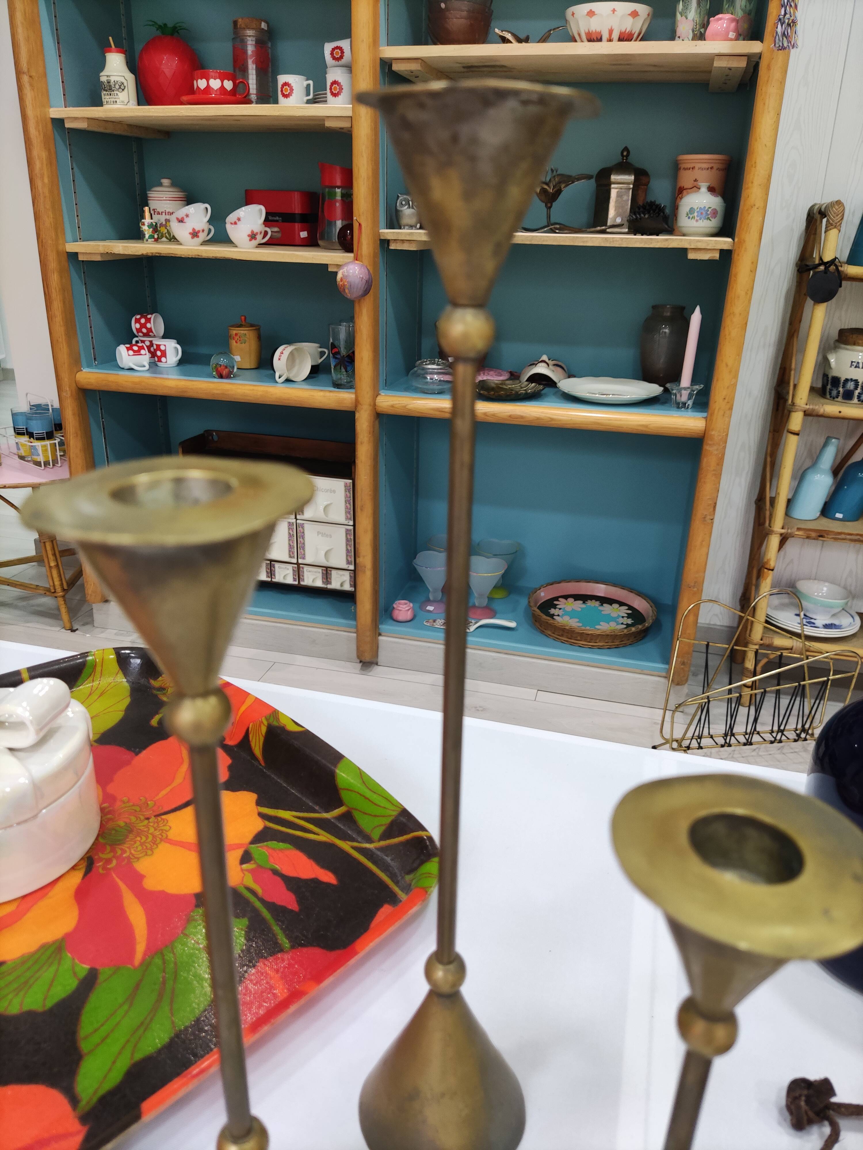 Trio of brass candlesticks design year 70