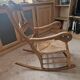 Oak rocking chair with a straw seat.