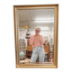 XL vintage bevelled mirror with a gold frame.