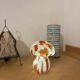 Mosaic glass mushroom lamp in orange, white, and clear.
