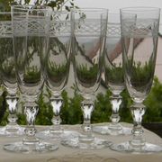 Set of 6 antique crystal champagne flutes. Engraved frieze.