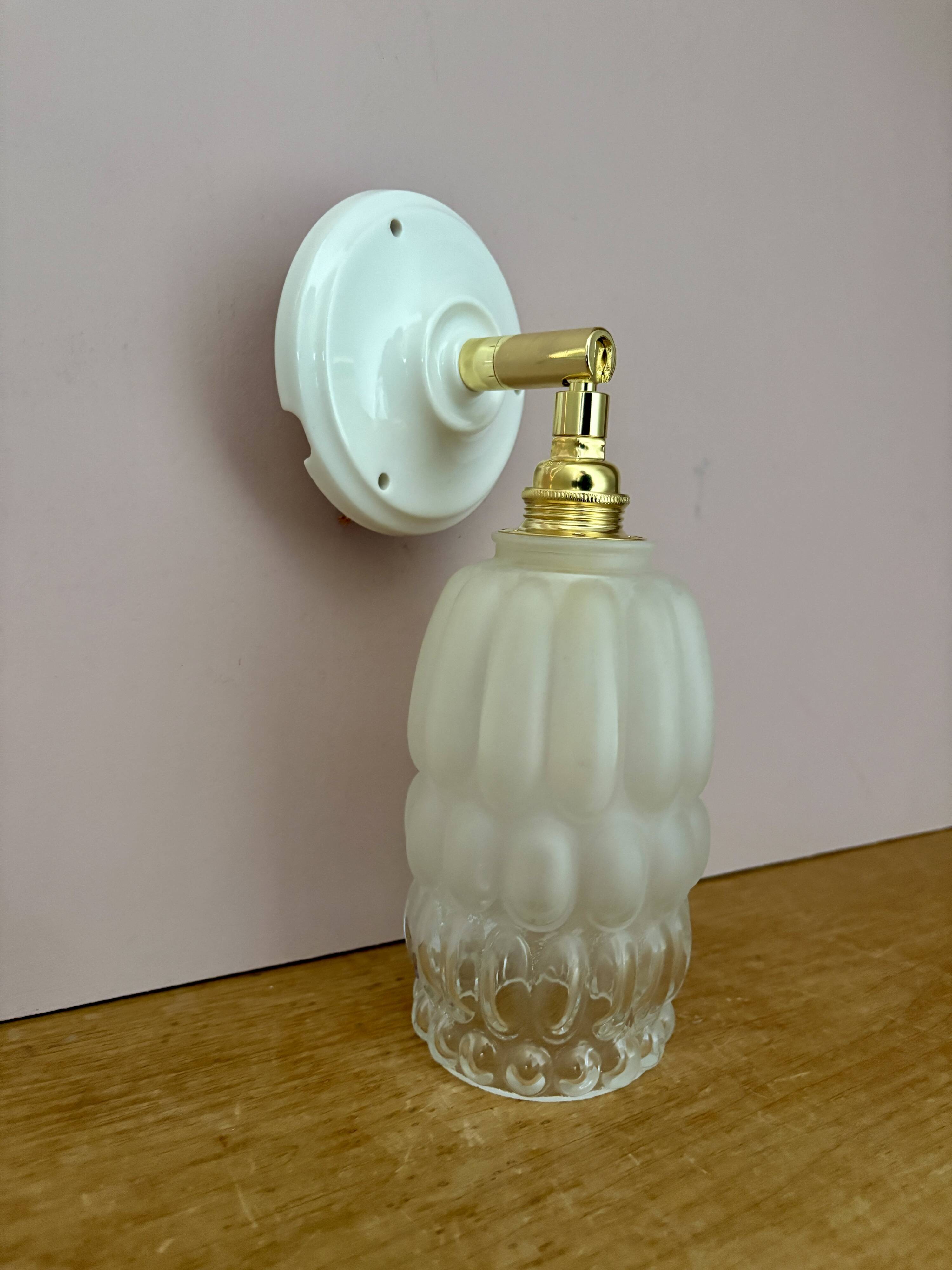 Vintage globe wall lamp in half frosted, half transparent glass