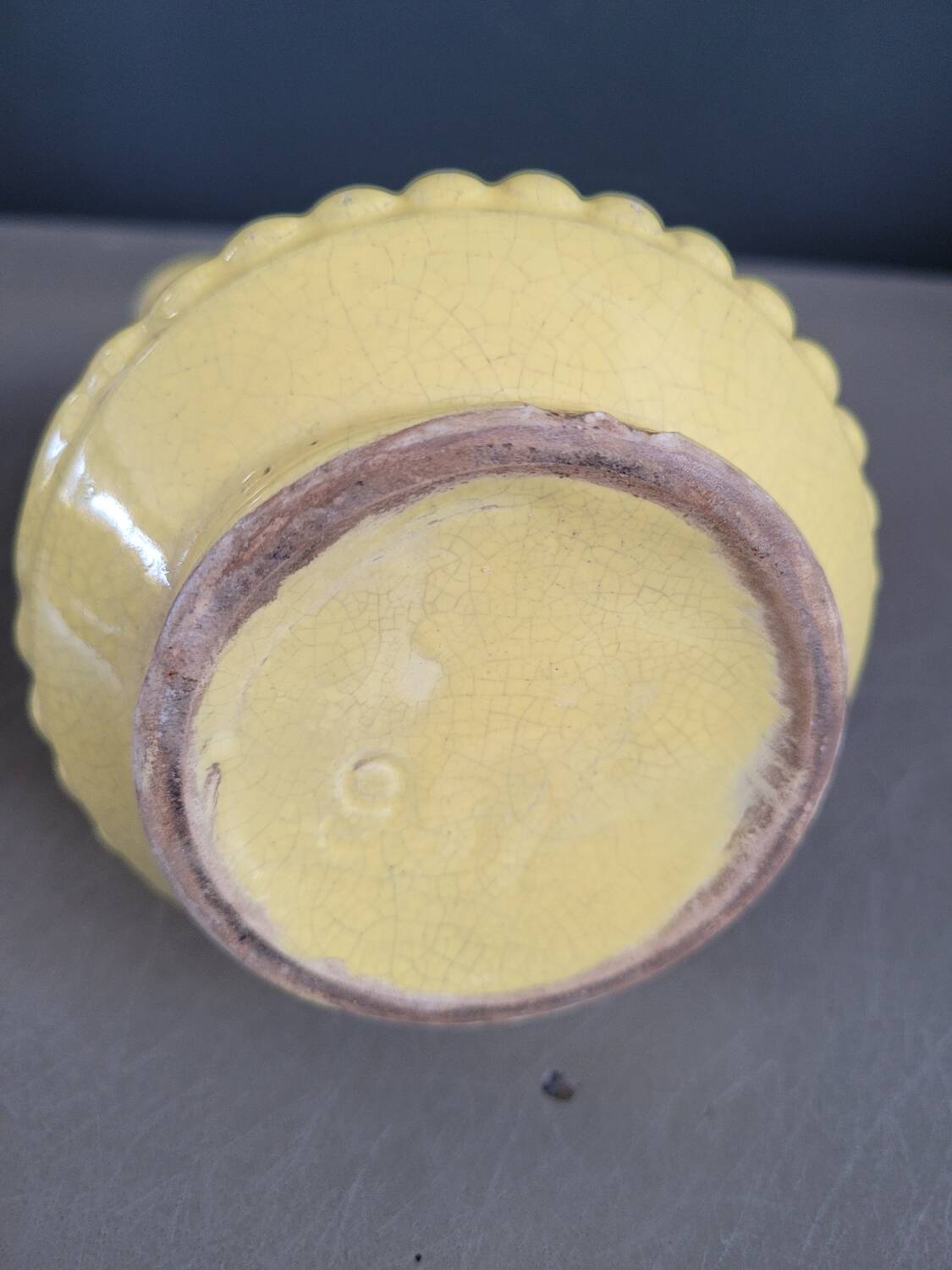 Yellow milk jug with reliefs