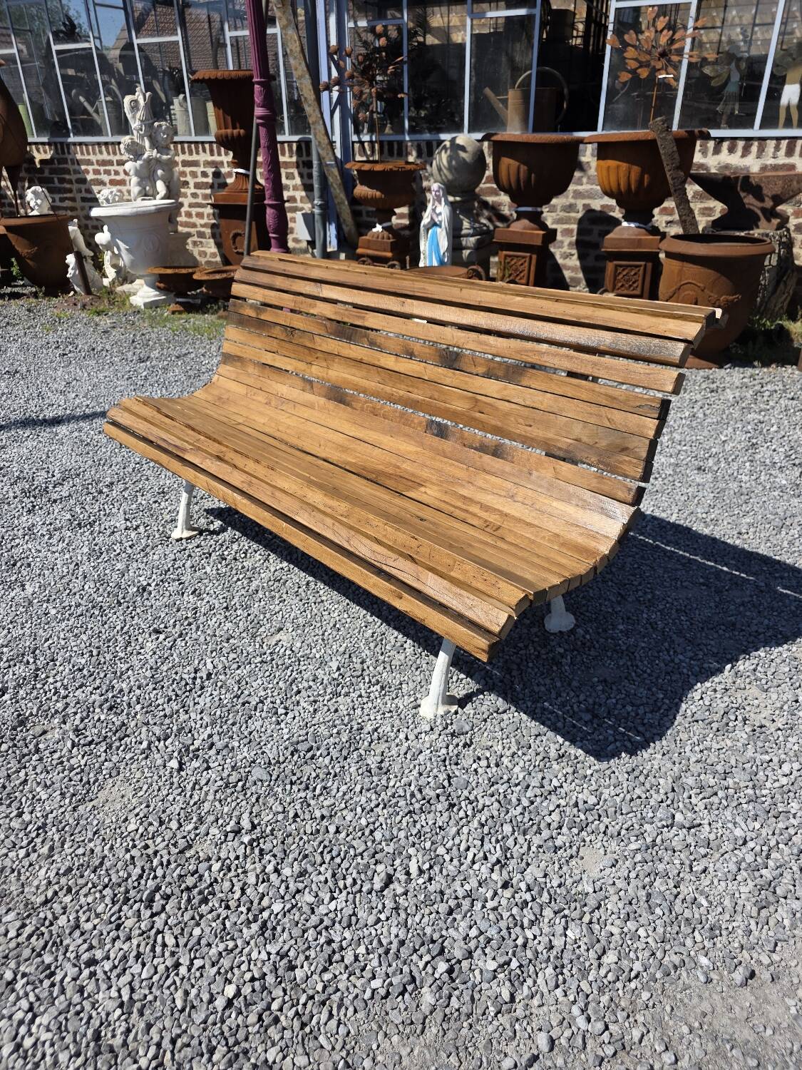 Antique garden bench made of cast iron and oak slats