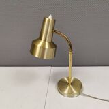 Older Swedish table lamp, estimated 1980s, in gold-colored aluminum with “bend”.