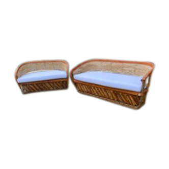 Two wooden and leather garden sofas