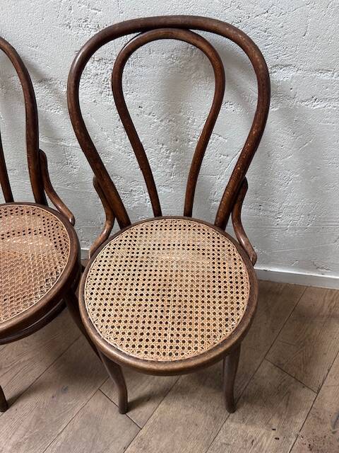Set of 2 bentwood bistro chairs with caning.