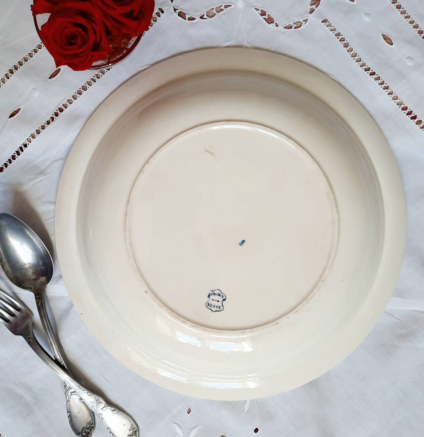 Old mismatched dinner plates accompanied by a dish