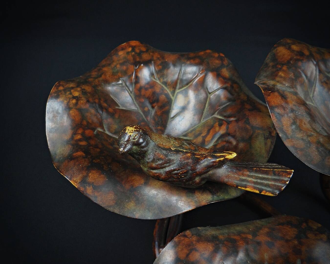 Three-tiered lotus leaf shaped patinated metal bird bath