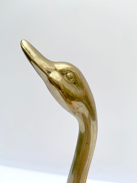3 golden decorative swans