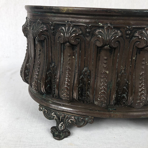 Old brass planter with brown patina