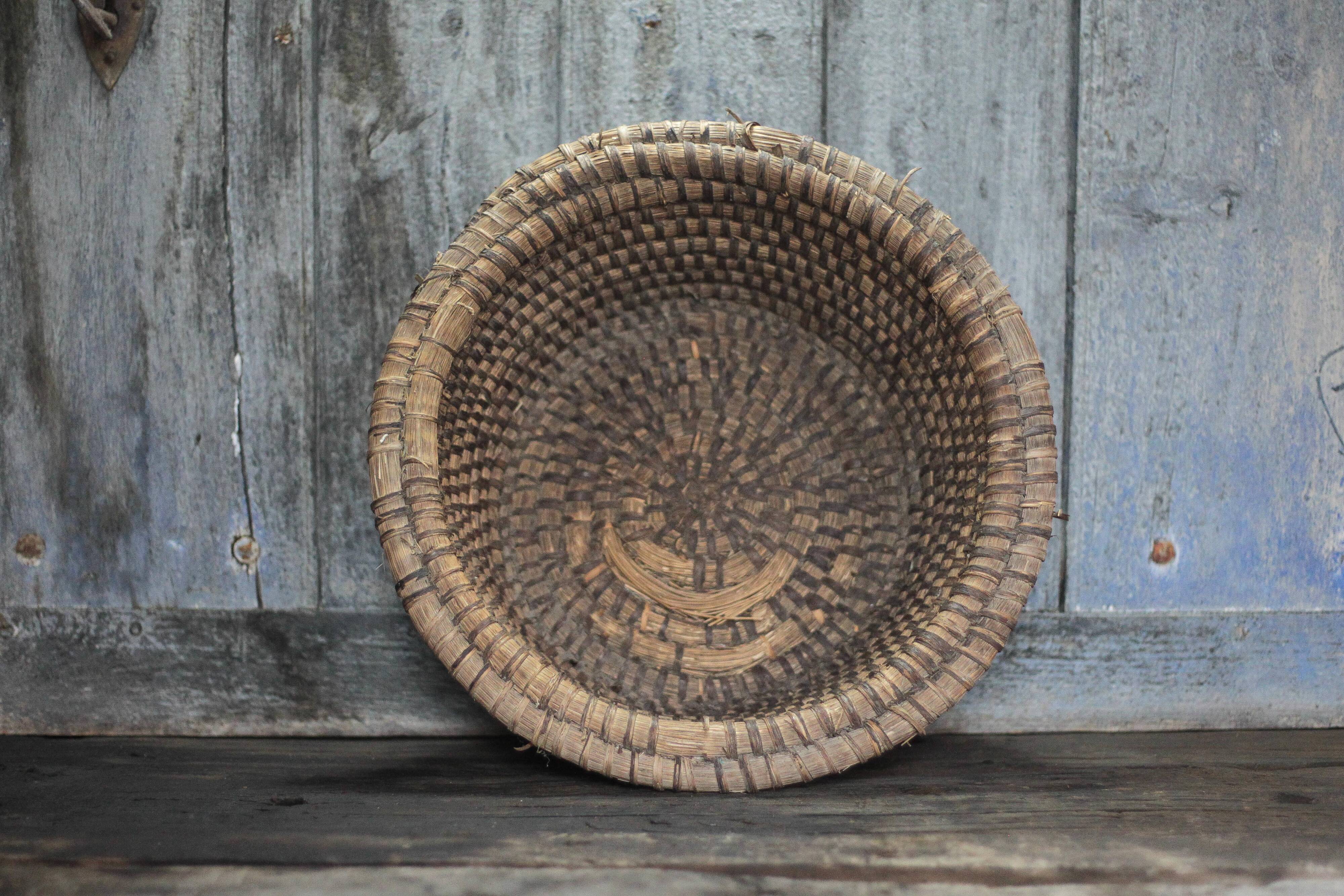 Old wicker basket, straw and bramble, woven basket, countryside.