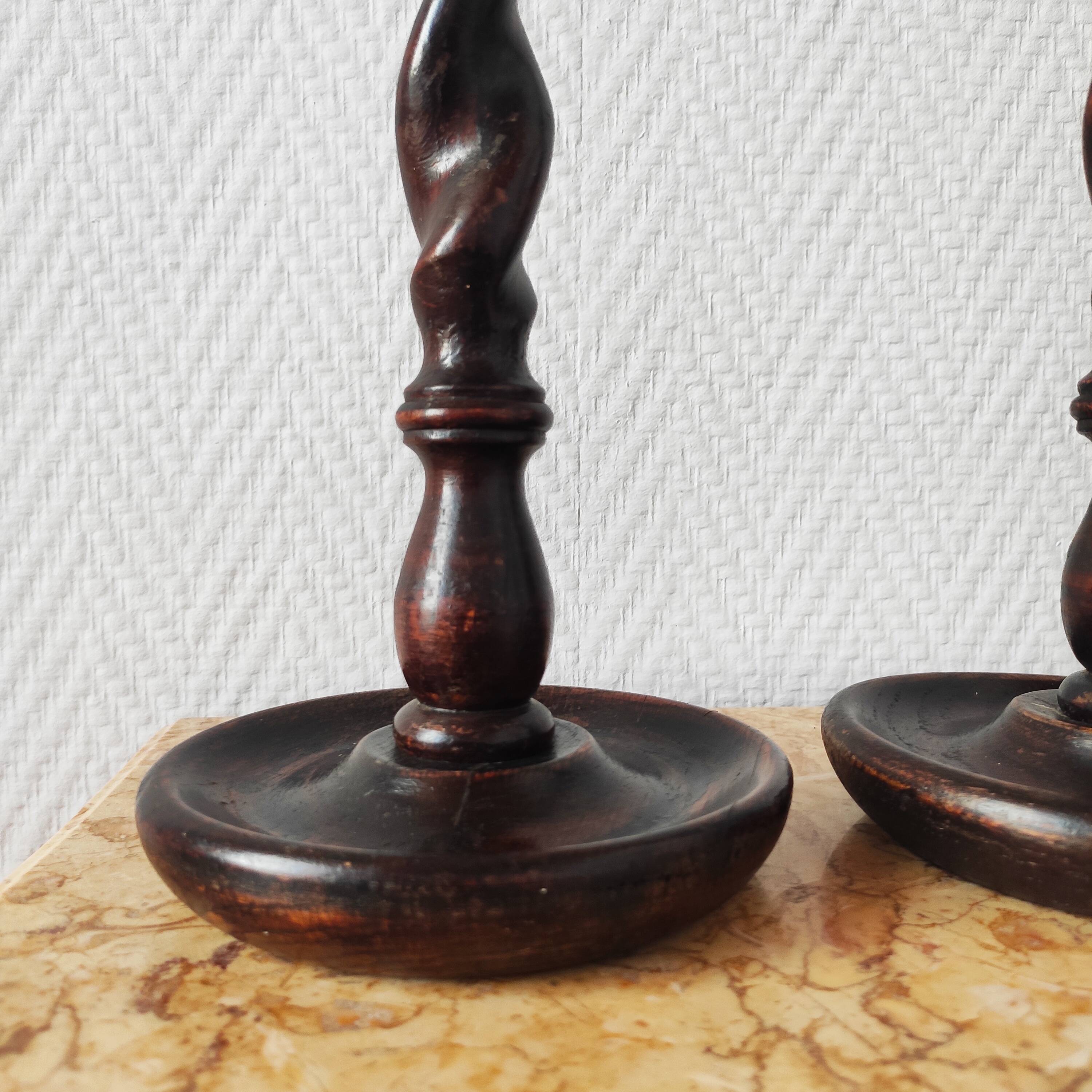 Old pair of English turned wood candlesticks