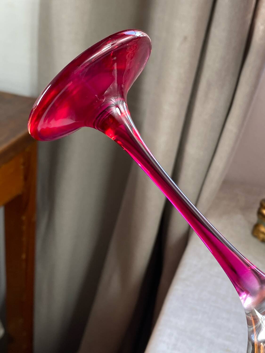 Champagne coupes in glass, multicoloured stems.