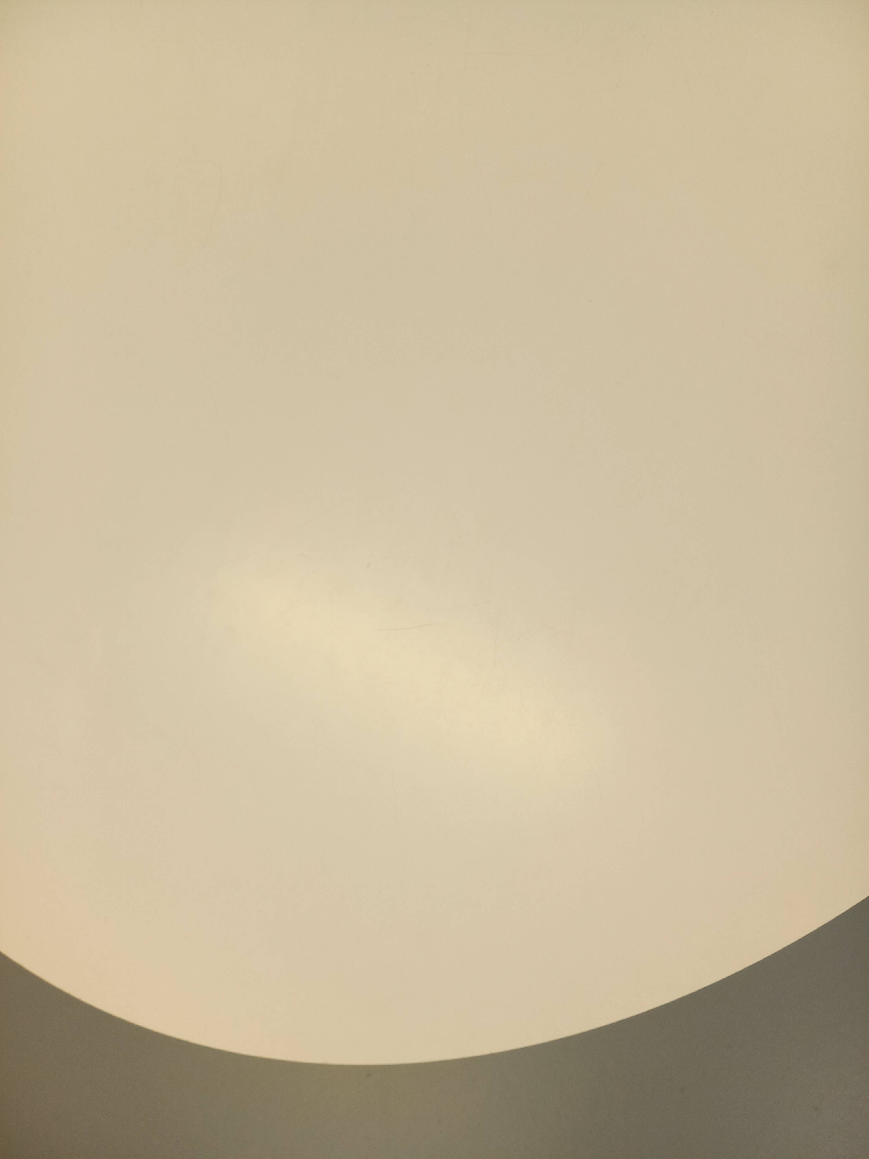 Vintage Eames round table for Vitra in white melamine, wood, and metal.