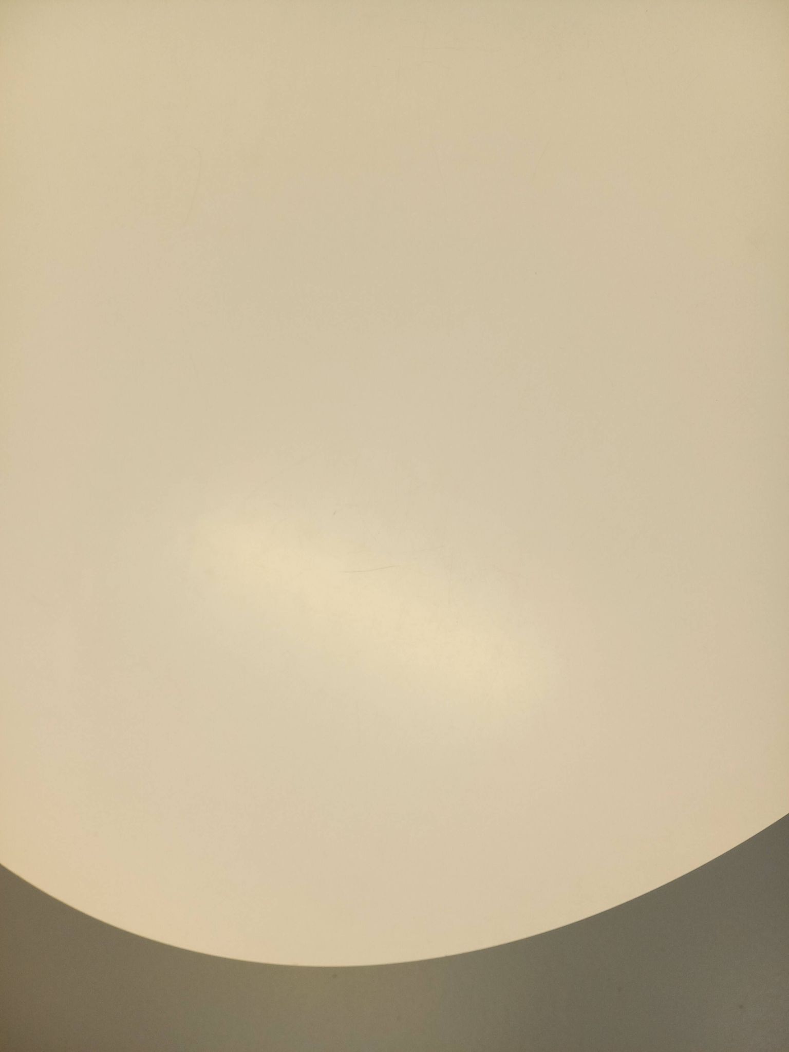 Vintage Eames round table for Vitra in white melamine, wood, and metal.
