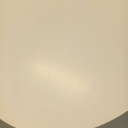 Vintage Eames round table for Vitra in white melamine, wood, and metal.