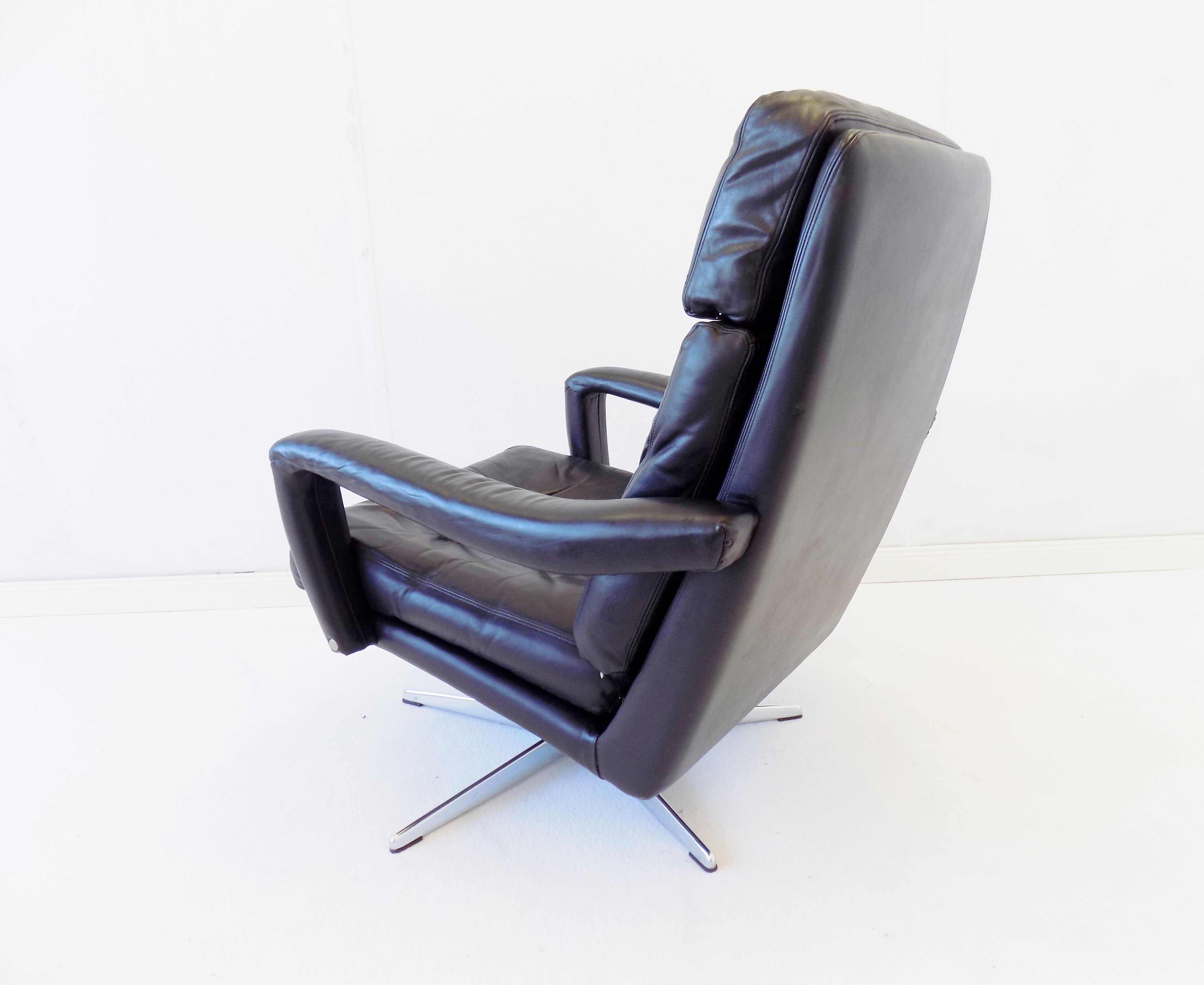 Danish black leather armchair with ottoman 70s