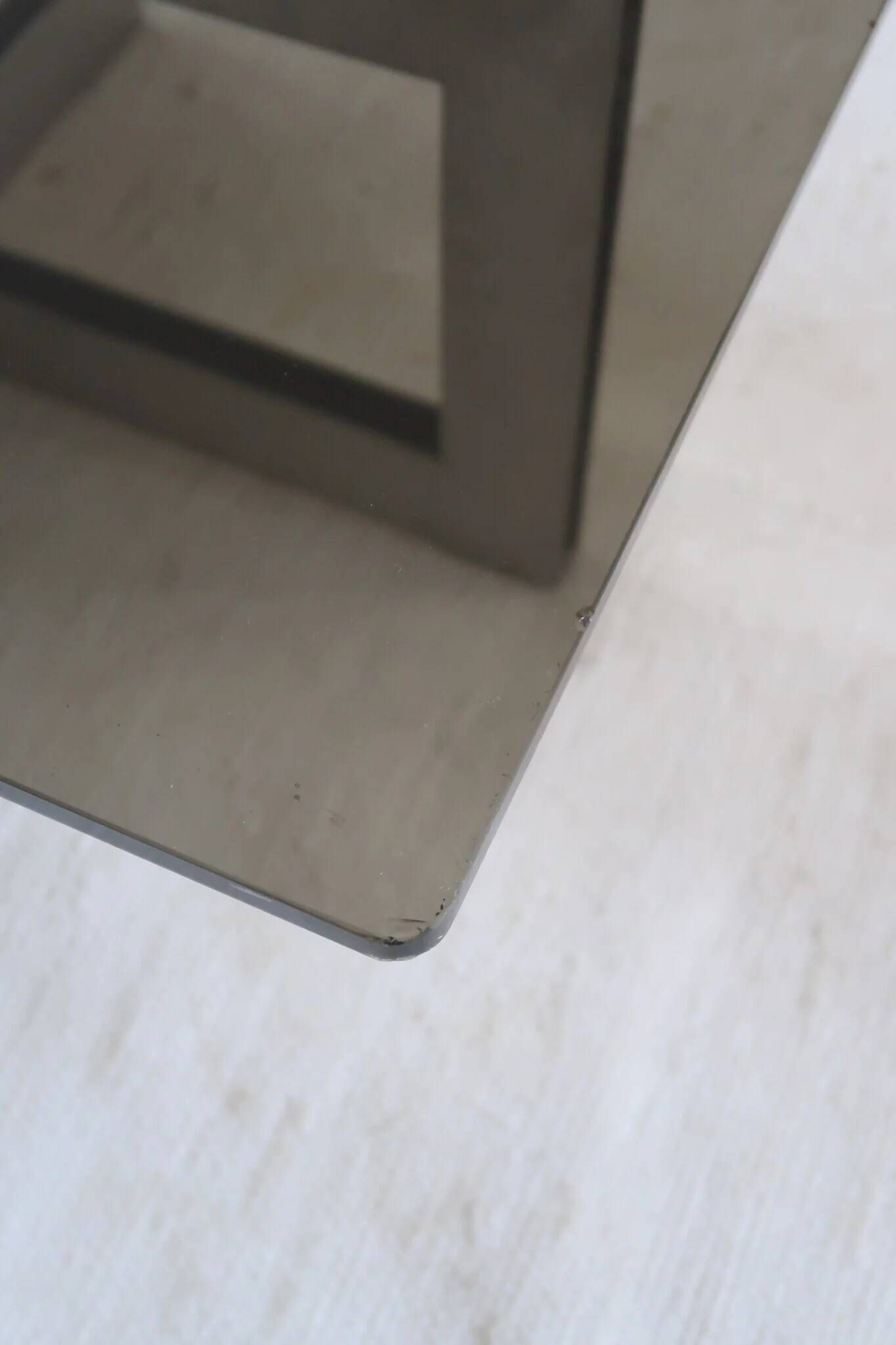 Smoked glass coffee table, brushed stainless steel base, 1970s.