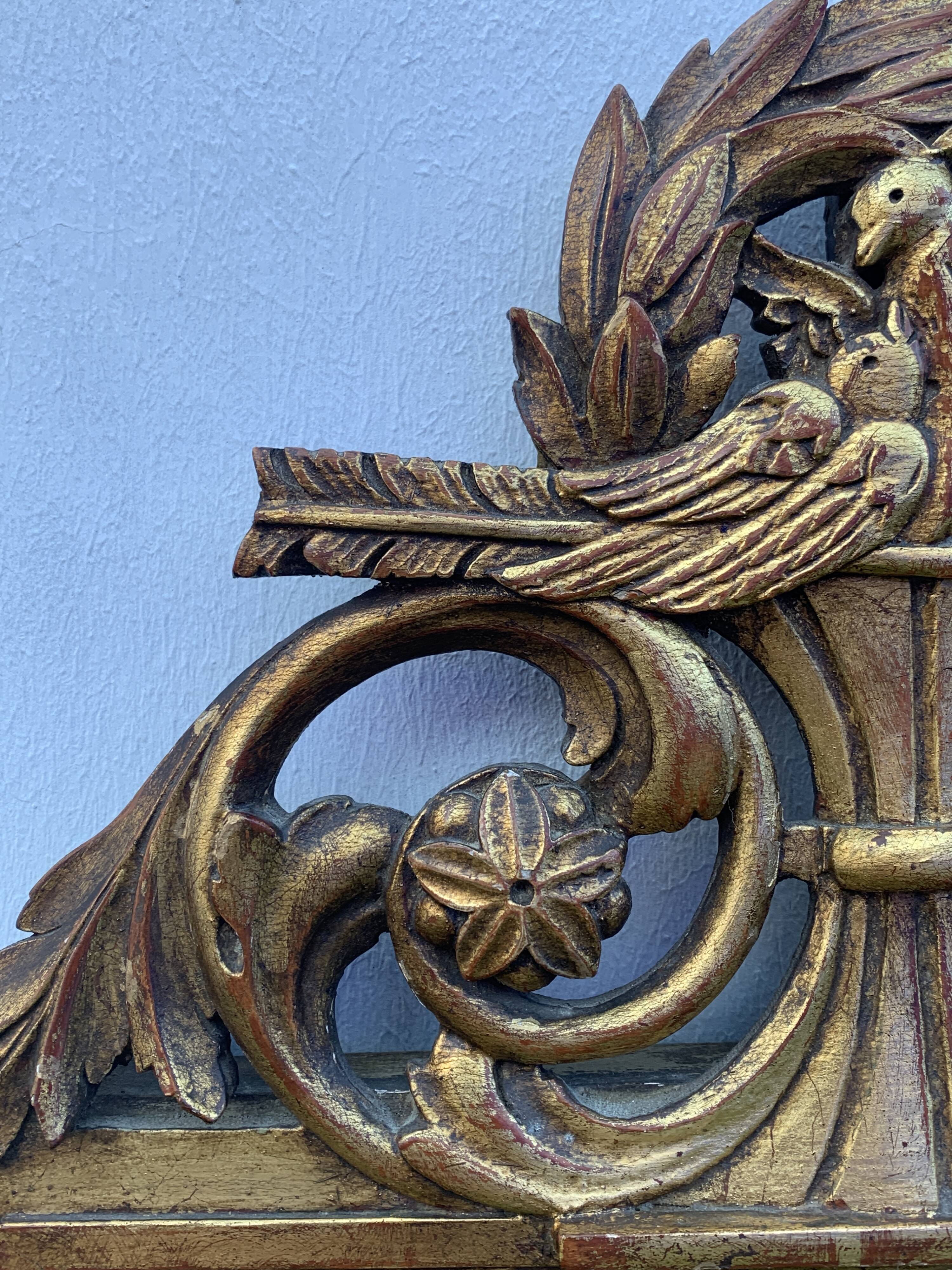 Antique mirror with gilded wood pediment, Louis XVI style