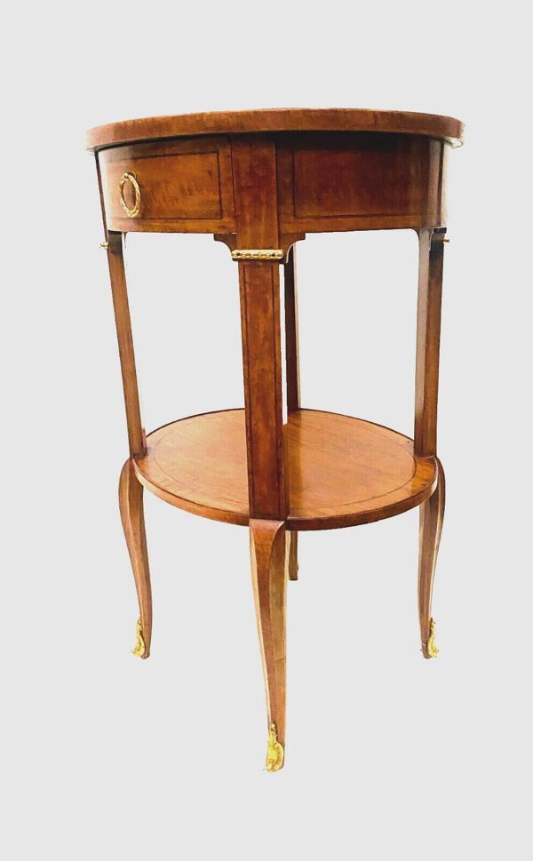 Gueridon ovale en bois de placage et filet de bois noir XX siècle