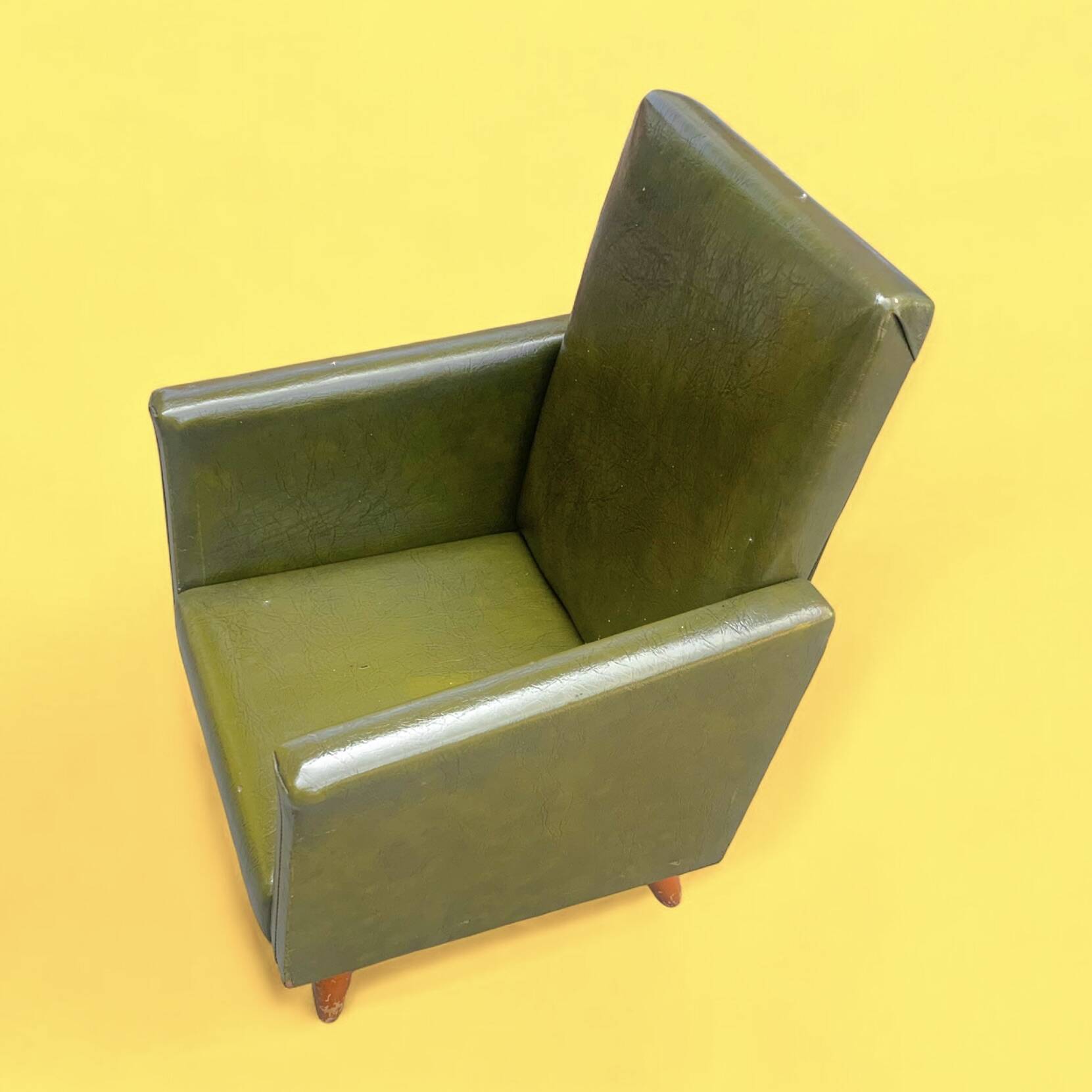 Vintage children's armchair in green skai