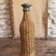 Woven wicker bottle