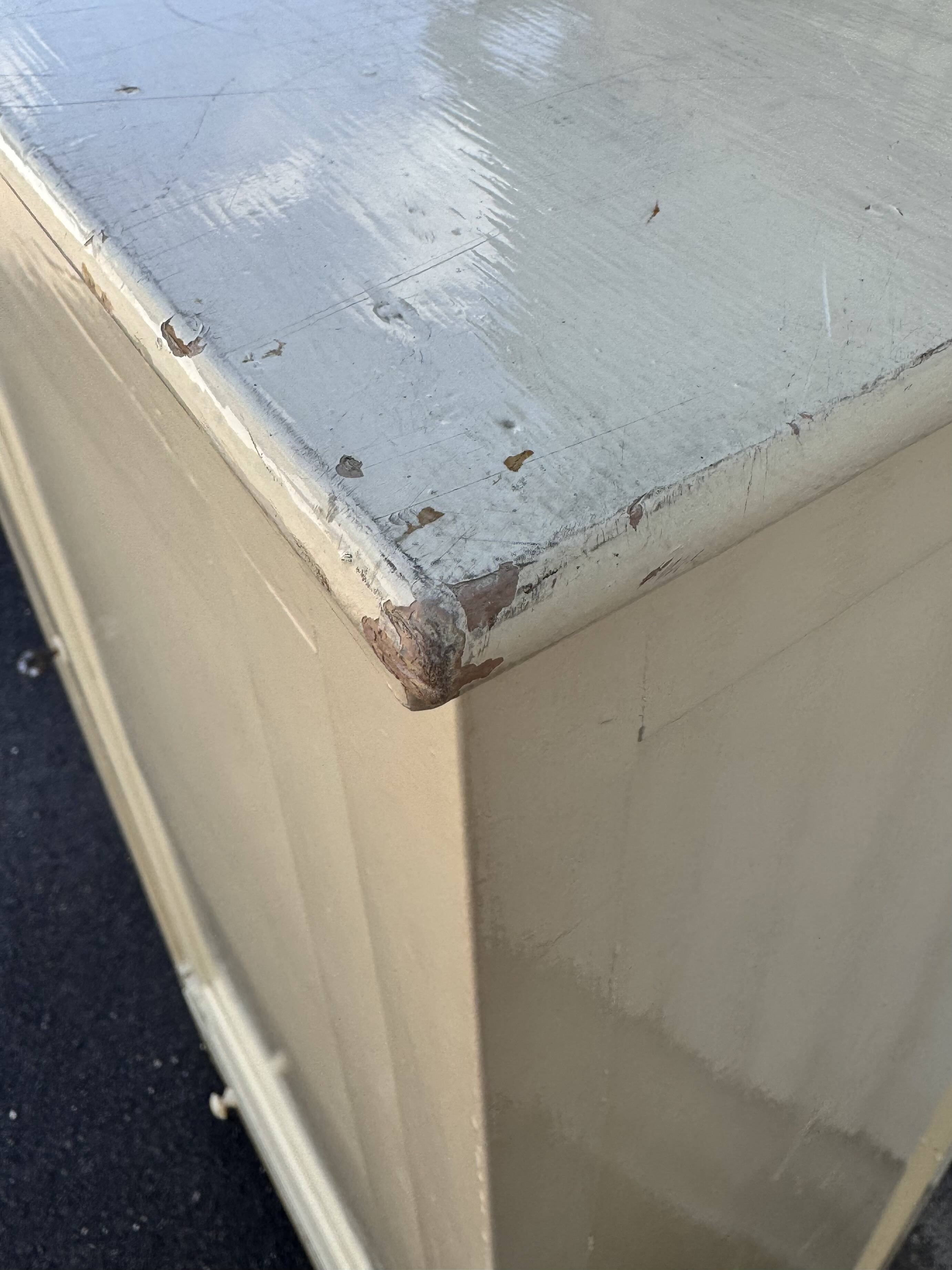 Antique painted wooden bonnet maker