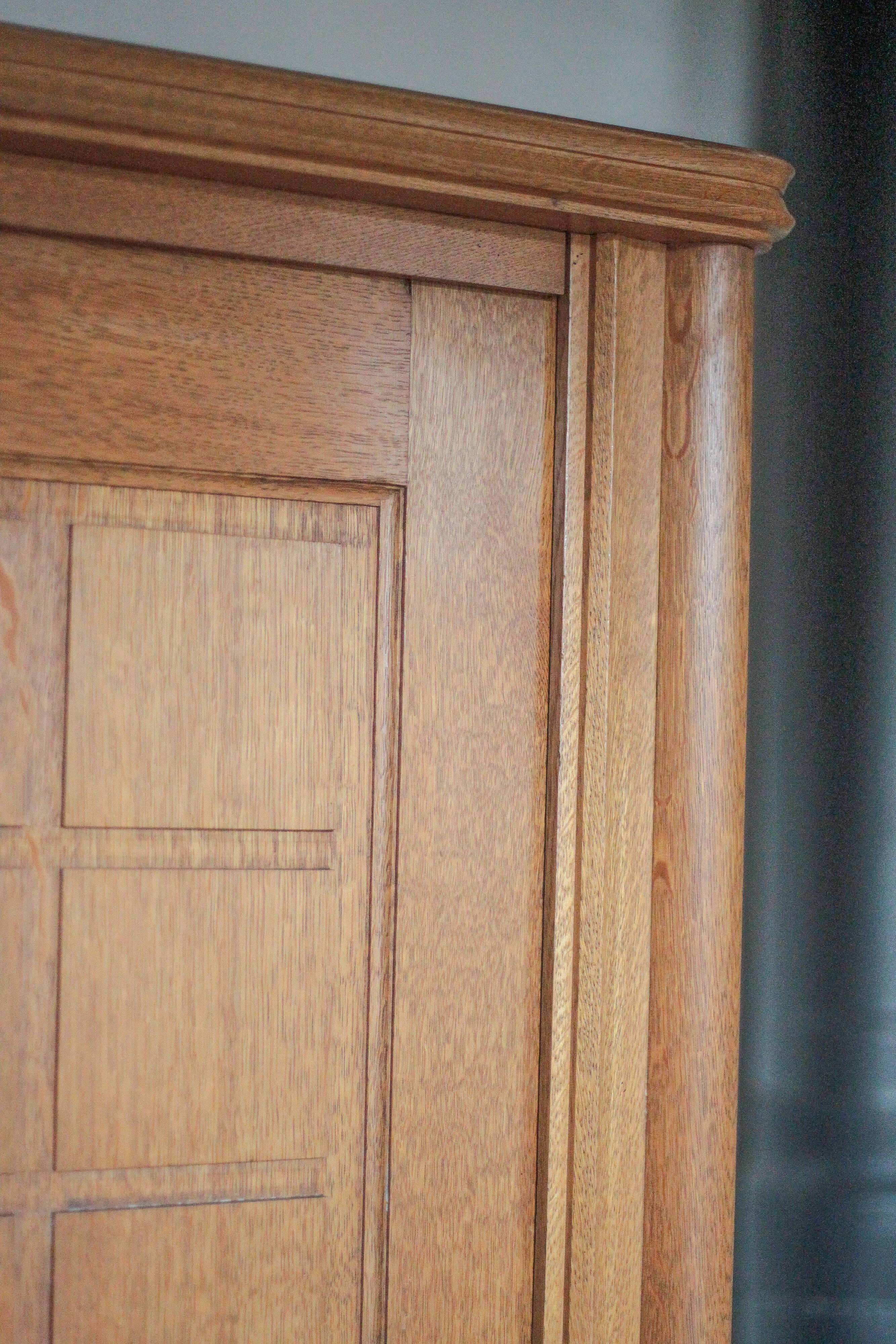 Vintage wooden wardrobe with sliding doors.