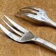 7 Christofle silver-plated oyster forks with Louis crossed ribbons