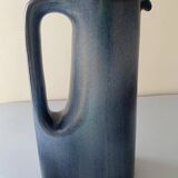 Sleek shaped pitcher in blue shaded ceramic. Signed under the base Stocker Fred and Andrée