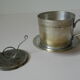 Individual silver metal coffee maker