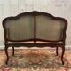 Louis XV mahogany and cane bench