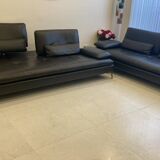 2 black leather sofas roche bobois scenario, one three-seater and one chaise longue.