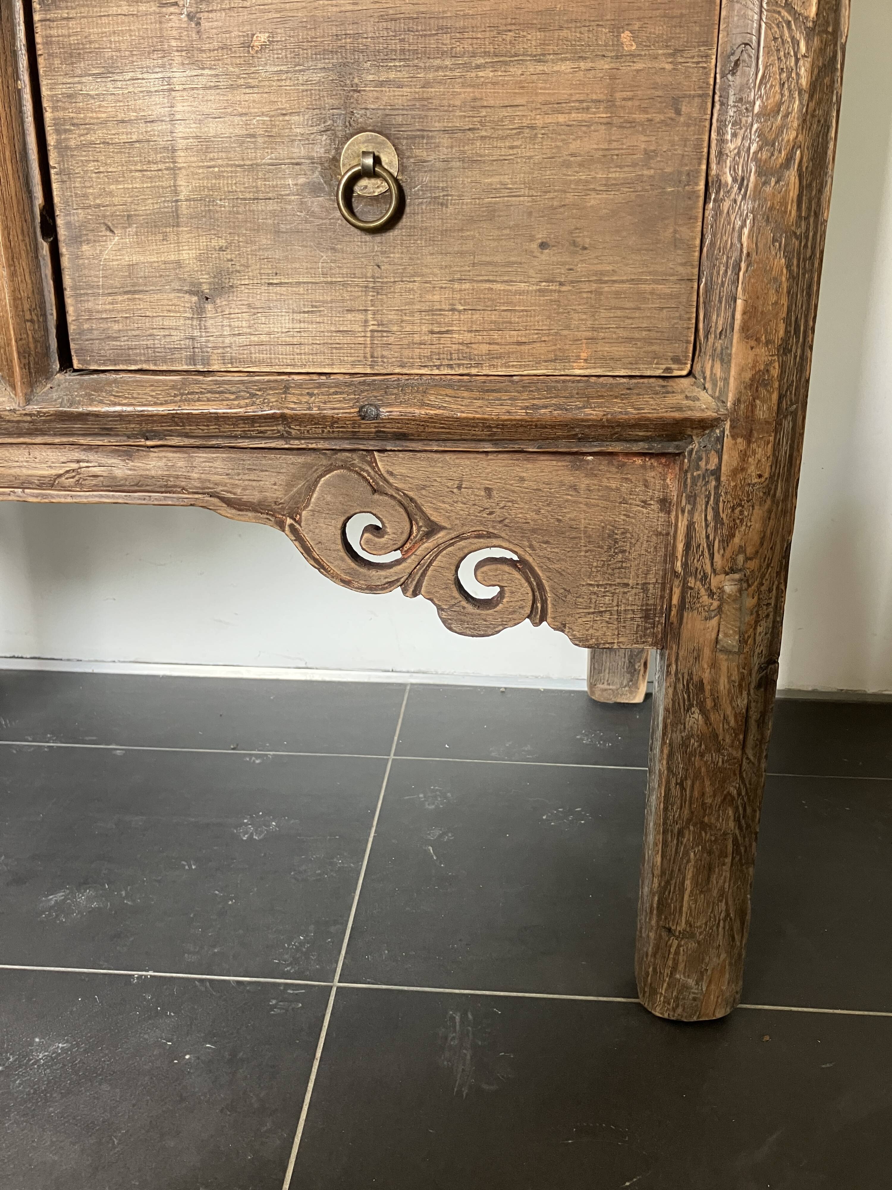 Very old elm wood with carved patterns and ironwork pieces.