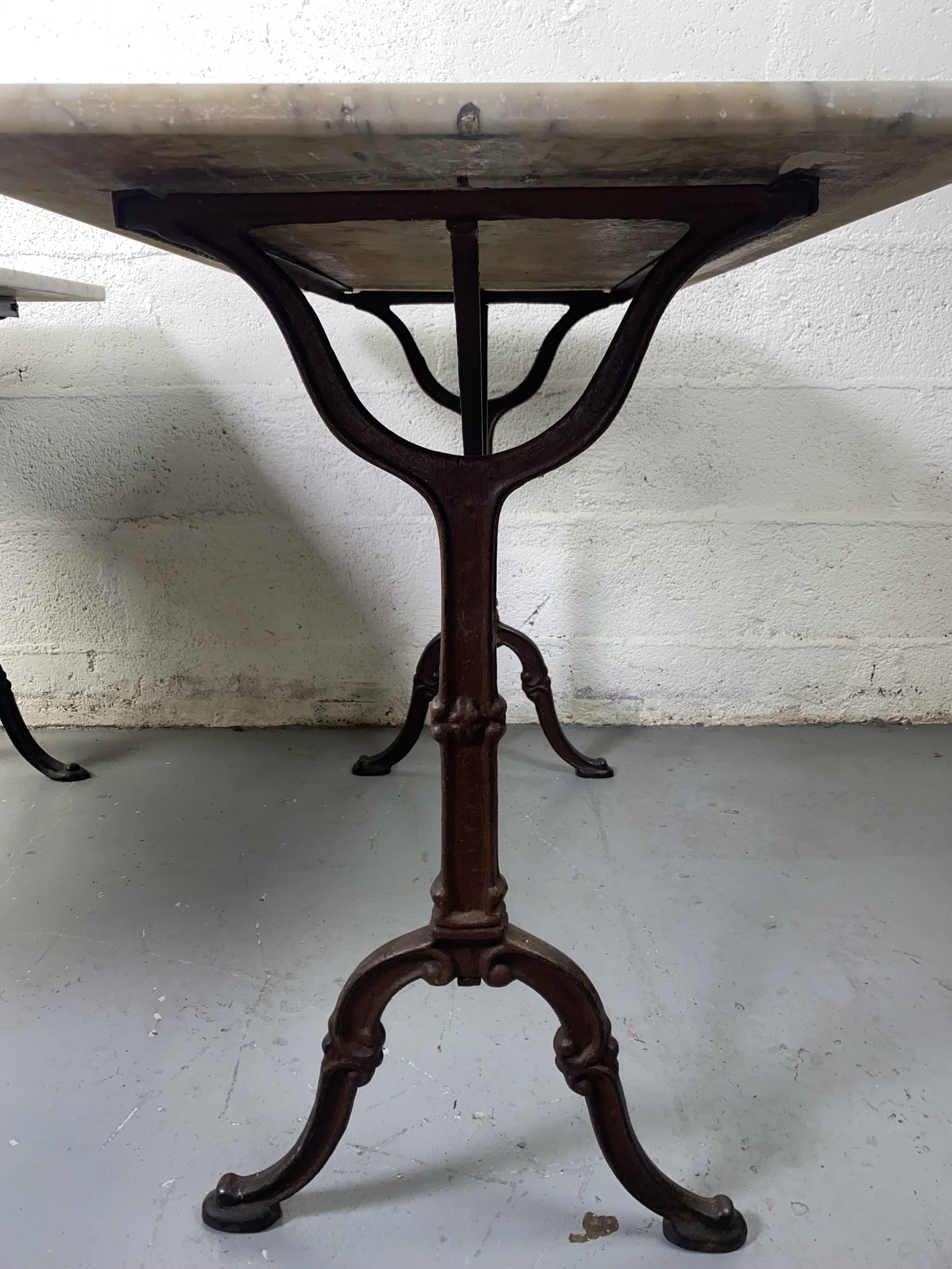 Set of two bistro tables in marble and wrought iron