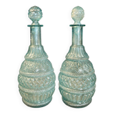 Pair of cut blown glass carafes in blue-green from the 19th century.
