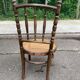 Vintage 19th-century bistro chair made of curved solid wood and caned in the Thonet style.