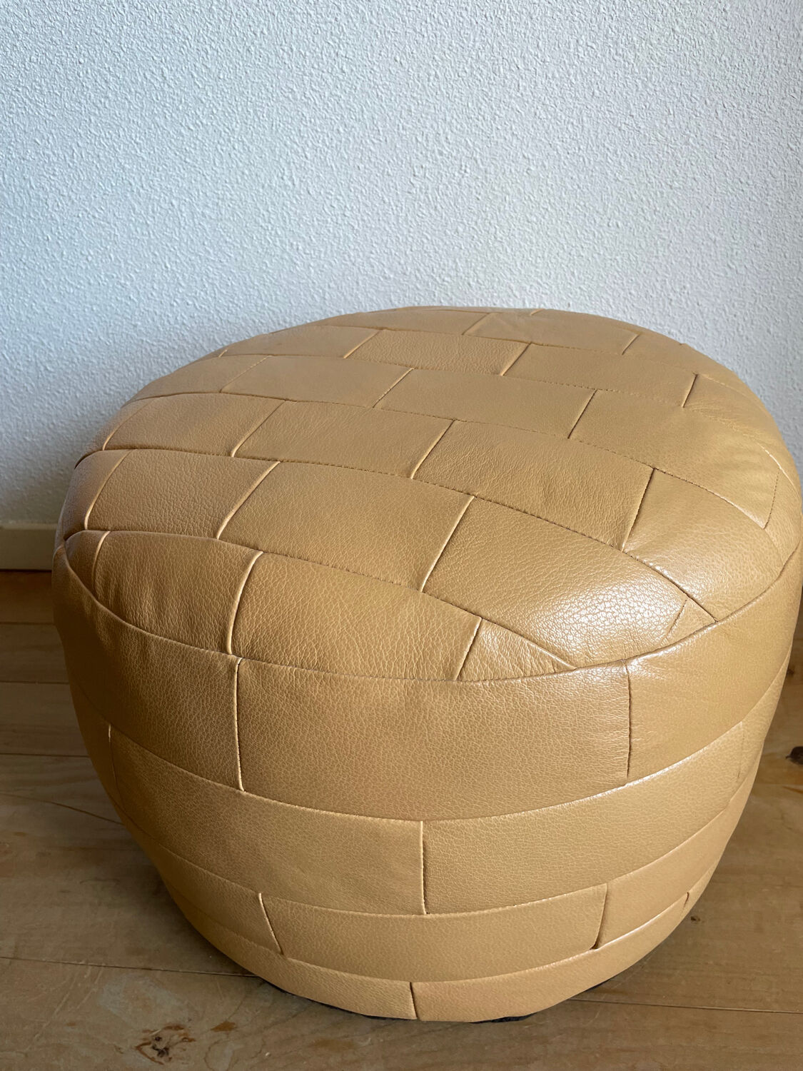 Beige patchwork leather pouf from Sède