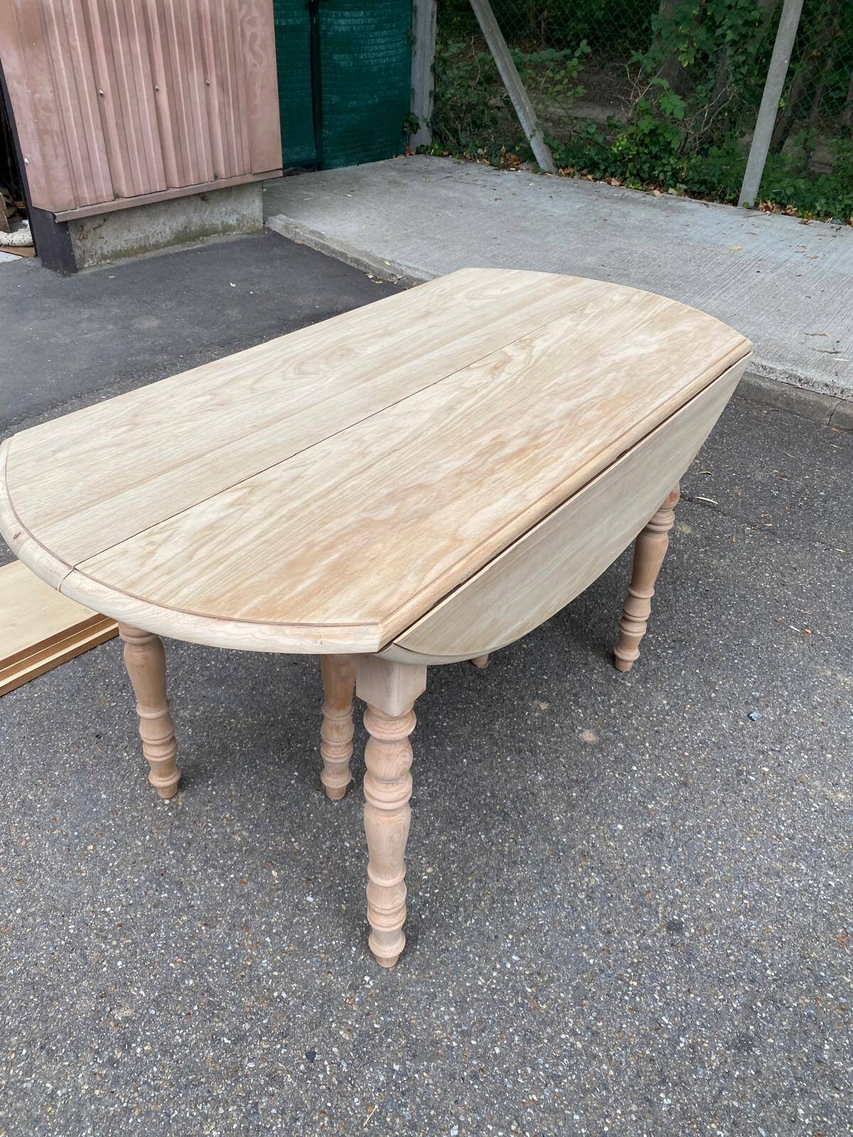Renovated Louis Philippe round extendable dining table with flaps and 3 extensions.