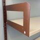 Modular metal wall shelf in brown and beige vintage 70s design.
