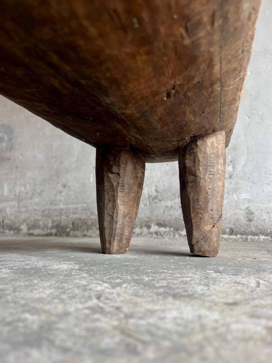 Large antique African bed in dark brown solid wood — sculptural, primitive, low, handcrafted
