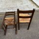 4 solid oak chairs in dark colour with elephant upholstery.