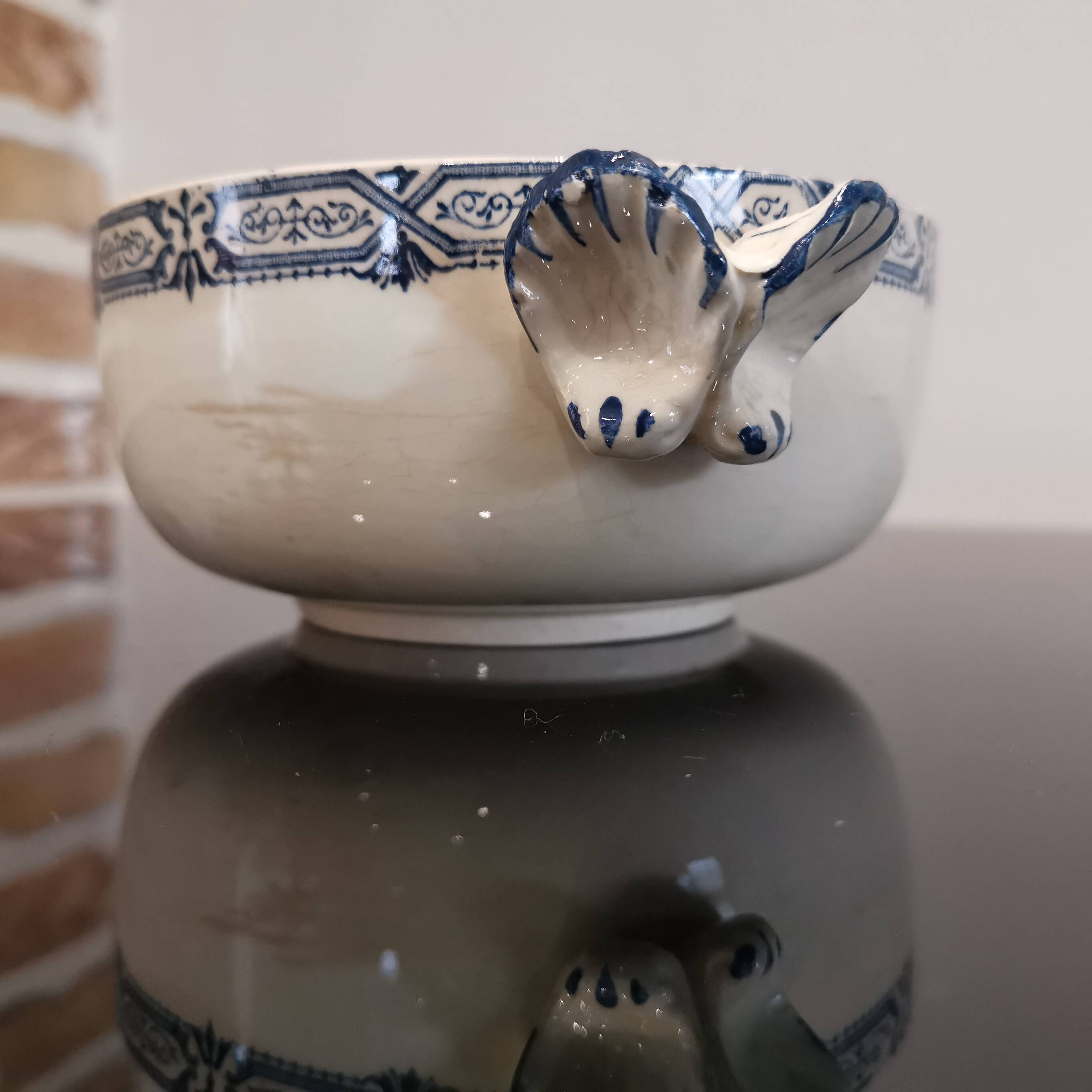 Butterfly ear bowl in iron clay with blue patterns