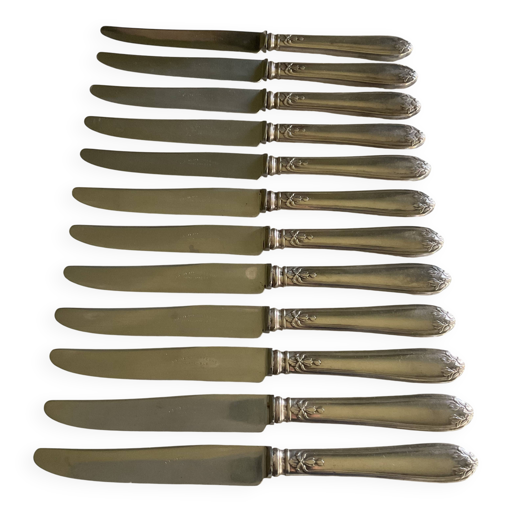 12 silver-plated metal knives. levert silversmith