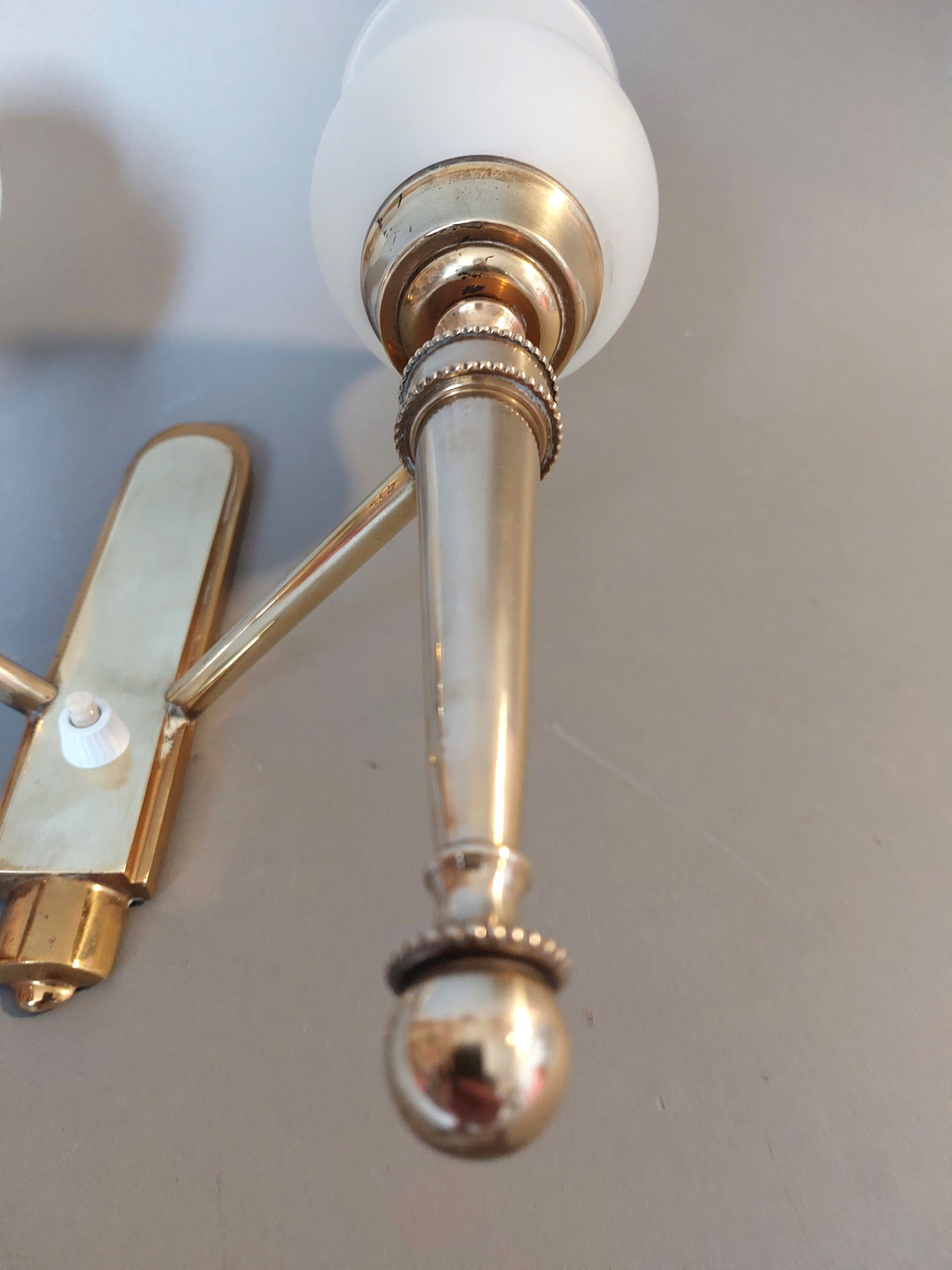 Neoclassical Torch two-arm wall lamp in solid brass, circa 1940